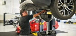 service-technician-working-on-a-car