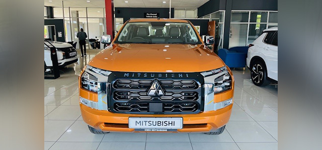 Orange Mitsubishi New-Gen Triton on the showroom floor